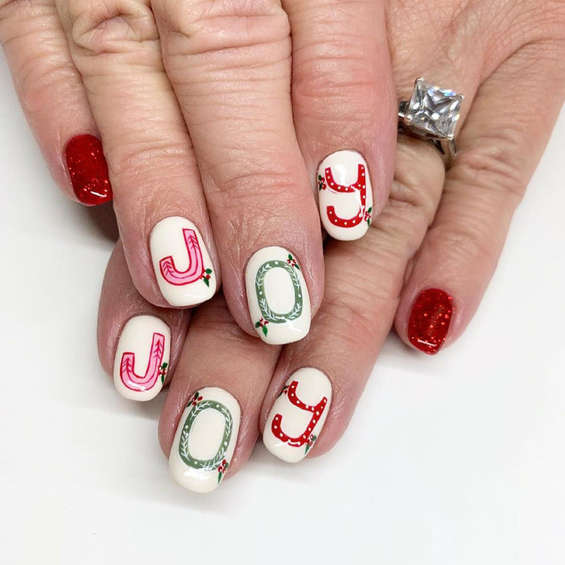 Cheerful Holiday Press On Nail Set Medium Oval White Red and Green Joyful Designs with Glitter Accents