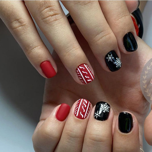 Winter Wonderland Short Oval Red and Black Press On Nail Set with Snowflake and Stripe Designs
