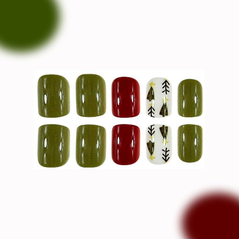 A set of press-on nails featuring a forest-inspired design with olive green, red, and white colors, and a festive tree pattern on the red nails.