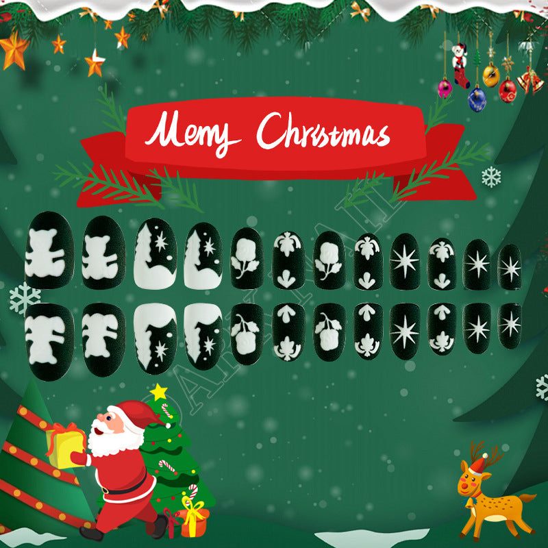 Festive Black Short Oval Press On Nail Set Featuring Charming White Christmas Icons and Elegant Seasonal Designs