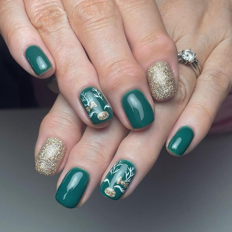 Enchanting Forest Inspired Short Square Emerald Green Press On Nail Set with Glittering Gold Accents and Elegant Holiday Designs