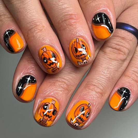 Halloween Pumpkin Themed Short Oval Orange and Black Press On Nail Set with Fun Jack-O-Lantern Designs