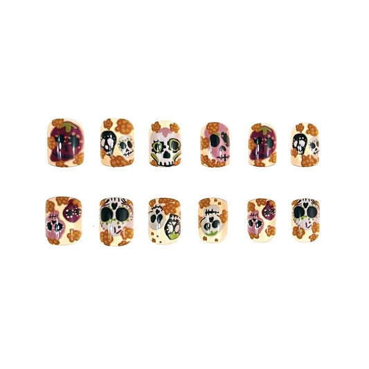 A collection of 16 press-on nails featuring a colorful skull and floral design.