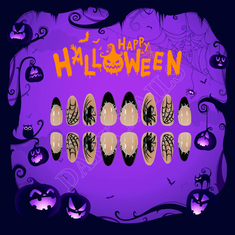 A set of press-on nails with a Halloween spider and web design, featuring long almond nails in black and beige colors.