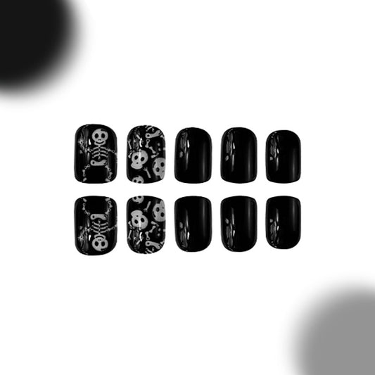 Spooky Skeleton Themed Short Square Black Press On Nail Set with Unique Skull and Bone Designs