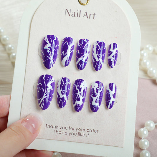 Lightning Inspired Long Oval Purple Nail Set with Bold White Patterns