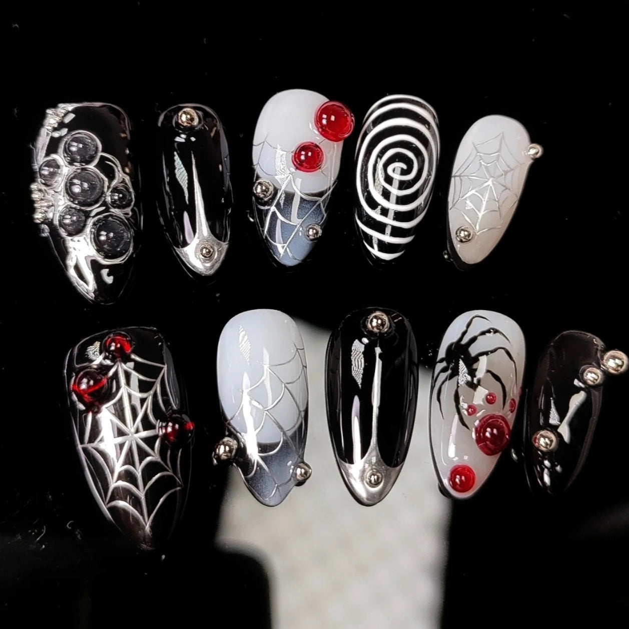 Spooky Elegance Medium Stiletto Black and White Spider Webs with Red Accents Nail Set