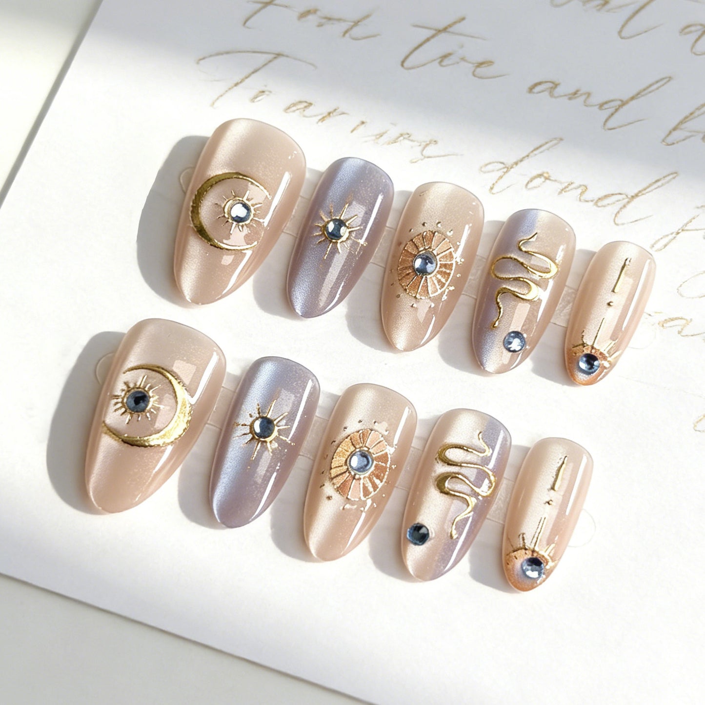 Celestial Chic Medium Almond Blush and Lavender Nails with Stunning Golden Accents