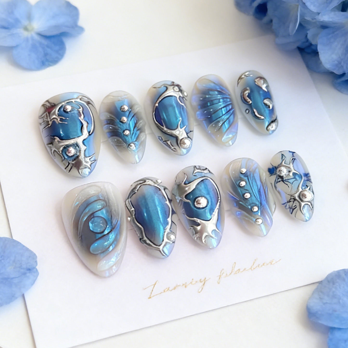 Azure Ocean Bliss Medium Almond Blue Nail Set with Dazzling Metallic Accents