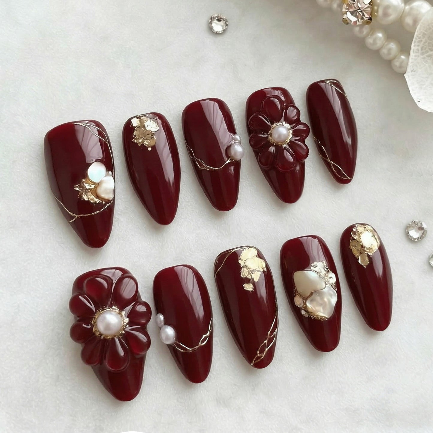 Elegant Floral Burgundy Medium Stiletto Nails with Stunning Gold Accents
