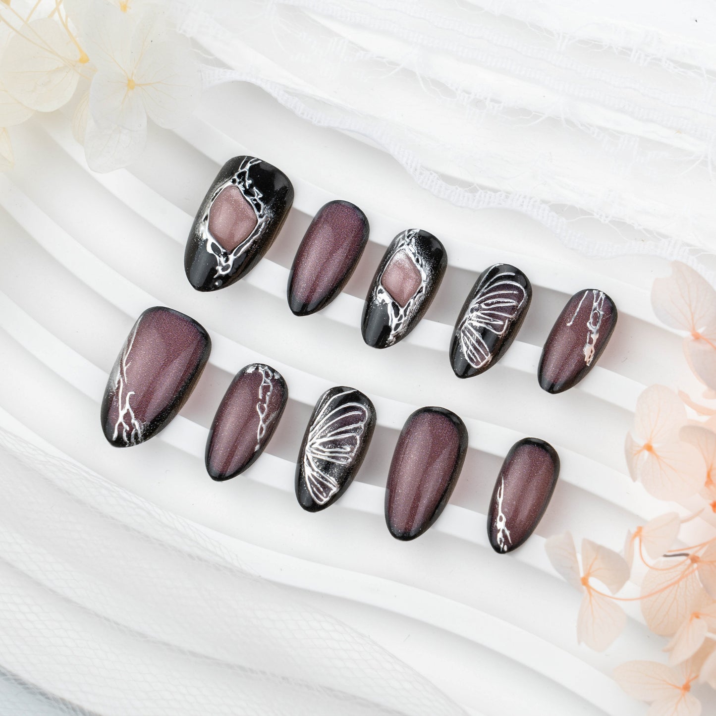 Mystical Elegance Medium Stiletto Black and Plum Nail Set with Intricate Metallic Designs