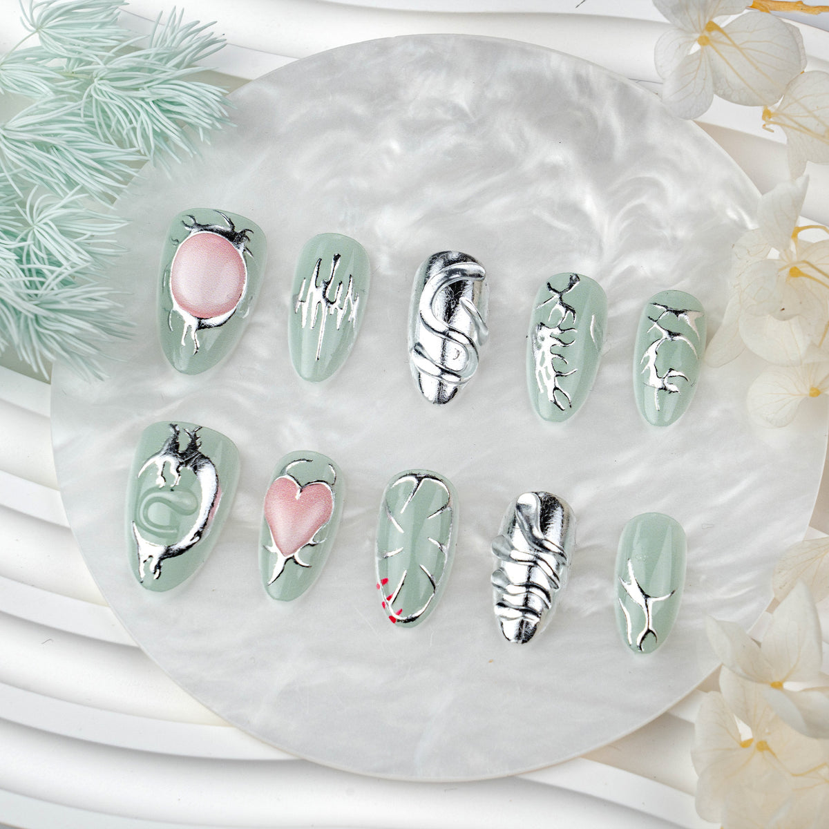 Whimsical Green Medium Almond Press on Nail Set with Unique Metallic Artwork