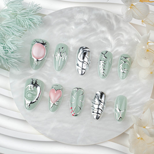 Whimsical Green Medium Almond Press on Nail Set with Unique Metallic Artwork