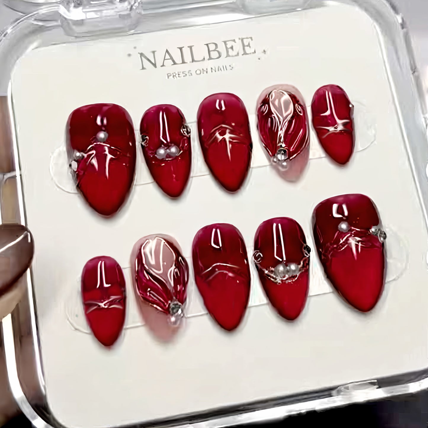 Glamorous Ruby Short Almond Press on Nail Set with Unique Pearl Accents