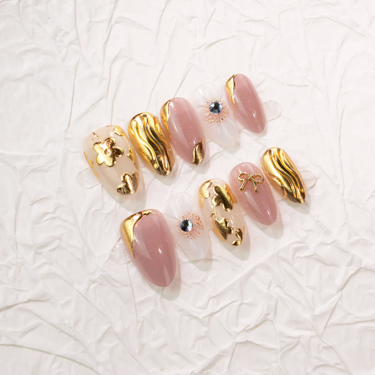 Elegant Rose Gold Blossom Medium Almond Shaped Nails with Chic Golden Accents