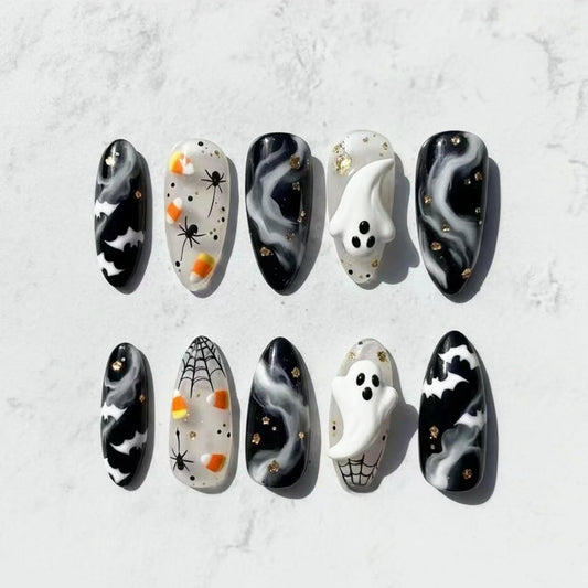 Spooky Enchantment Medium Almond Black and White Marble with Ghost Accents Press on Nail Set