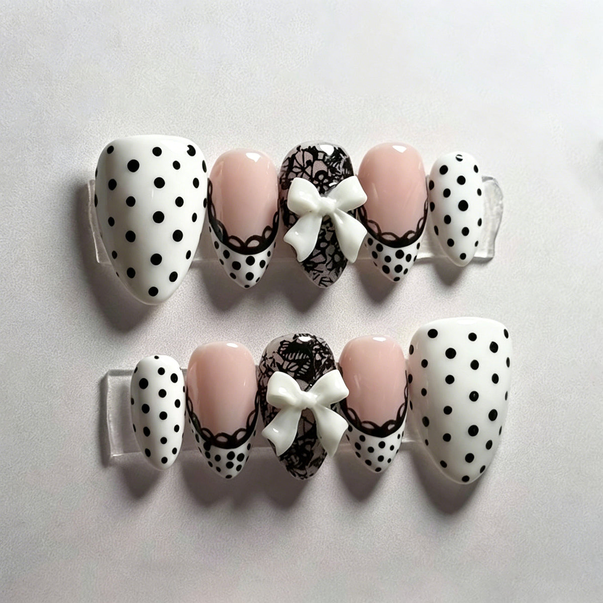 Charming Vintage Inspired Short Almond White and Black Polka Dot Press On Nail Set with Cute Bow Accents
