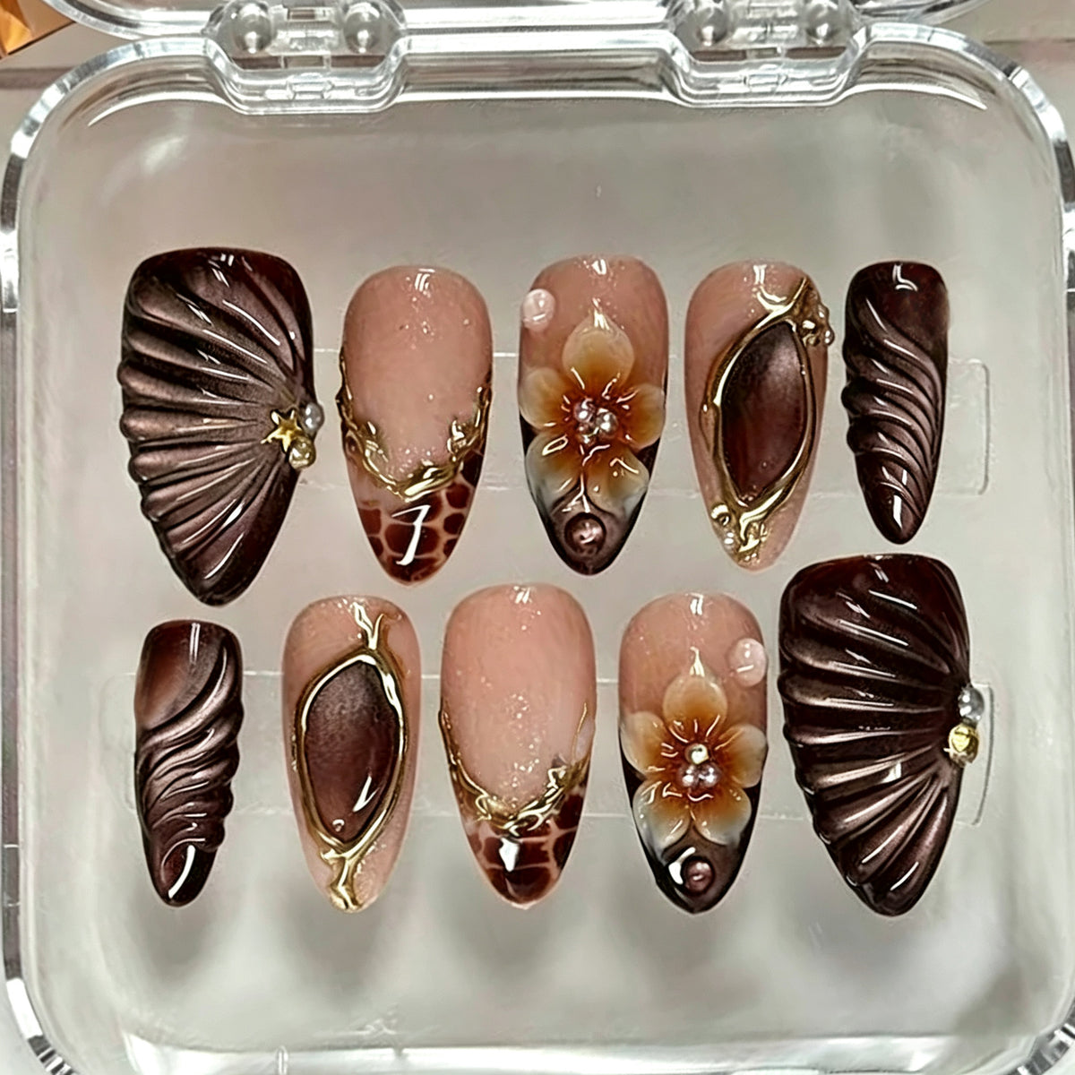 Elegant Oceanic Medium Almond Brown Nails with Floral Accents