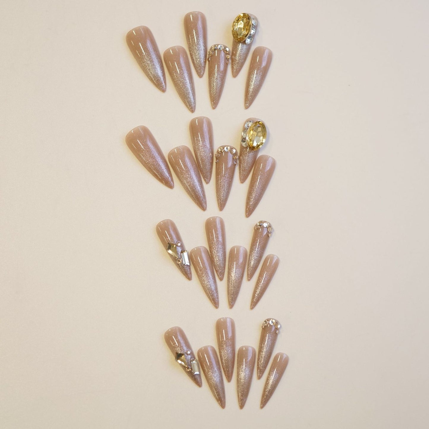 Glamorous Elegance Pointed Long Stiletto Beige Press On Nail Set Featuring Stunning Rhinestone Accents