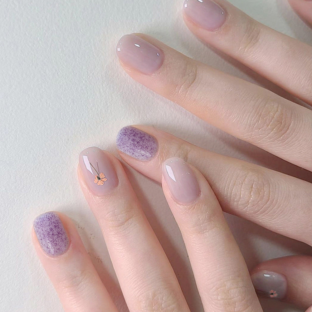 Whimsical Lavender Short Squoval Glossy Press On Nail Set with Eye-Catching Floral Accents and Textured Highlights
