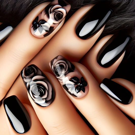 A set of long, black press-on nails featuring a floral design with a prominent rose pattern.