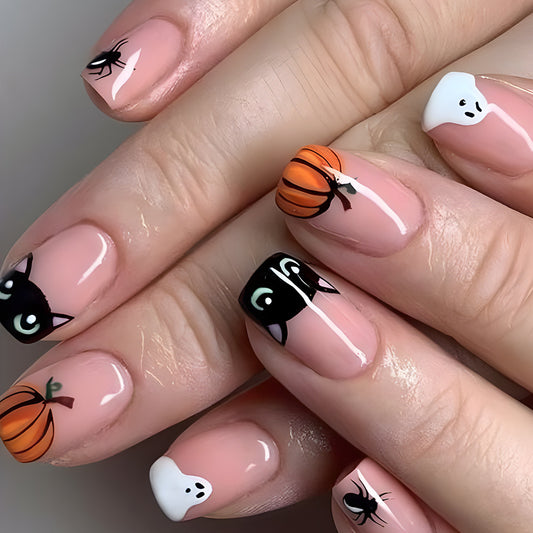 A set of press-on nails featuring a variety of Halloween-themed designs including pumpkins, ghosts, and cats in black, orange, and white colors.