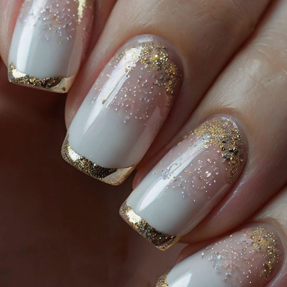 Glimmering Sunset Short Square Press On Nail Set in Transparent White with Gold Glitter Tips
