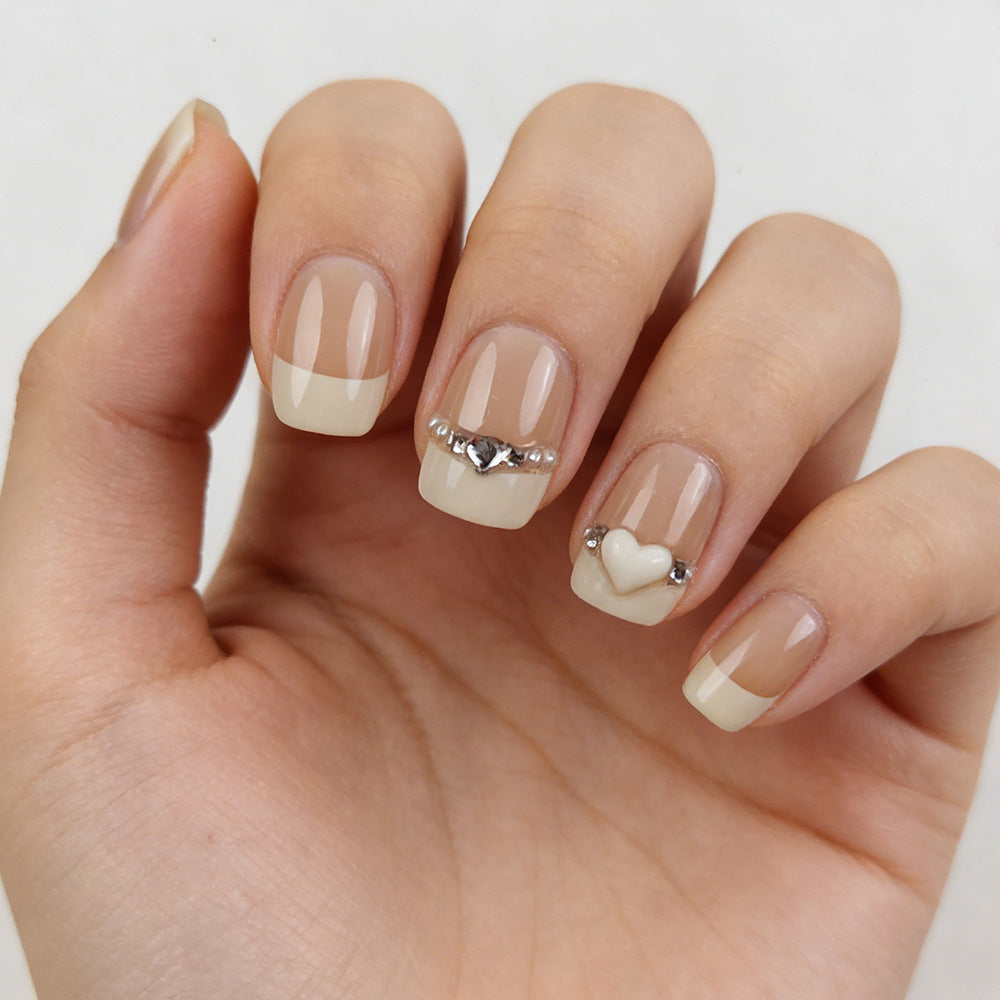 Charming Elegance Short Square Beige Nails with Heart and Gemstone Designs