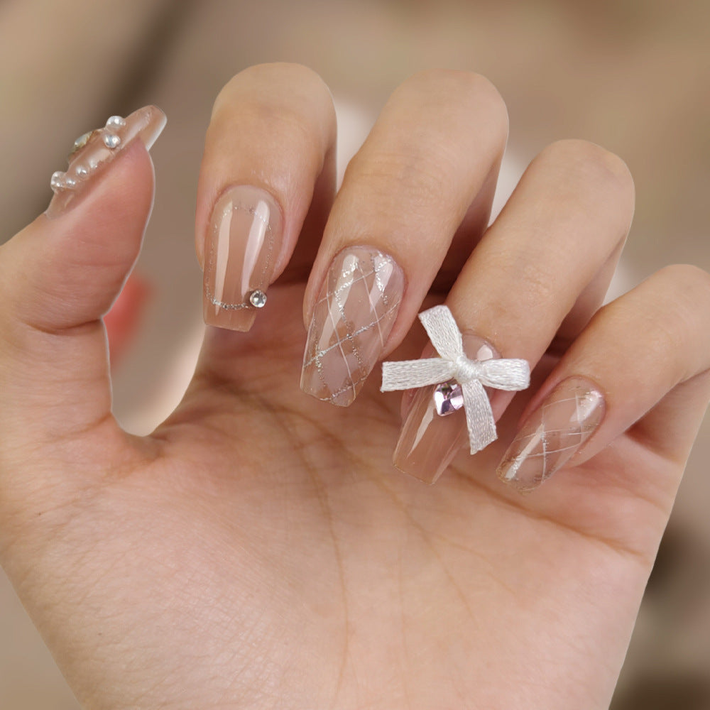 Elegant Fairy Tale Long Coffin Beige Press On Nail Set with Sparkling Accents and Charming Bow Feature