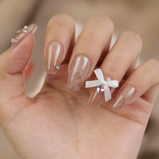Elegant Fairy Tale Long Coffin Beige Press On Nail Set with Sparkling Accents and Charming Bow Feature