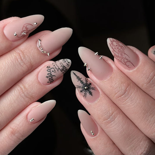 Vintage Enchantment Long Almond Pink Matte Nails with Intricate Black Detailing and Decorative Studs