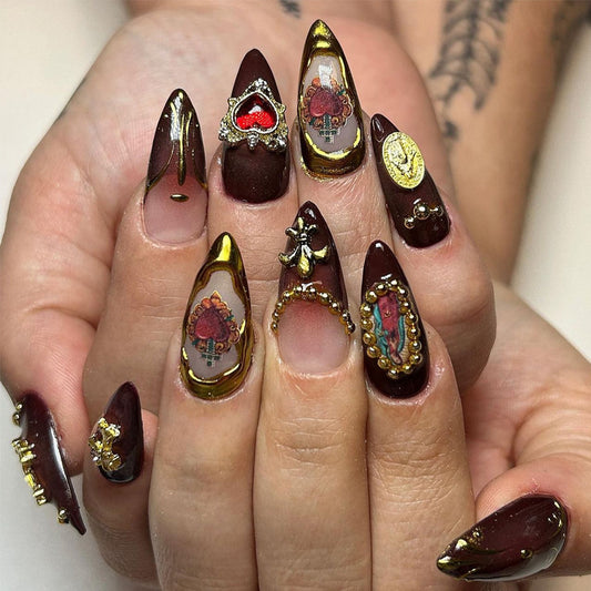 Bohemian Glamour Long Stiletto Burgundy Nail Set with Intricate Gold Accents and Unique Art Designs