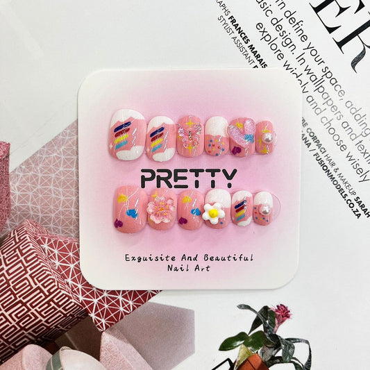 Kid's Whimsical Floral Elegance Short Oval Pink Press On Nail Set with Unique Decorative Accents