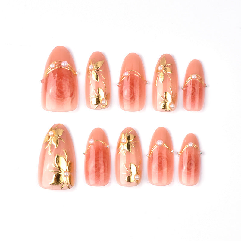 Blossoming Elegance Short Almond Coral Nail Set with Floral Accents and Pearls