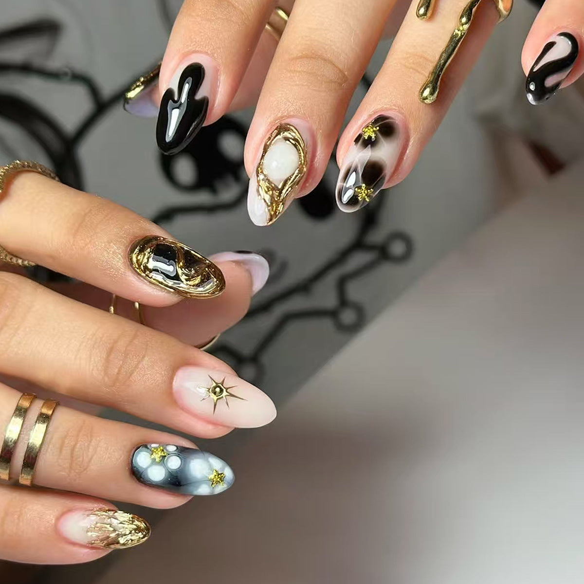 Galactic Glamour Medium Almond Black and Gold Decorative Nail Set