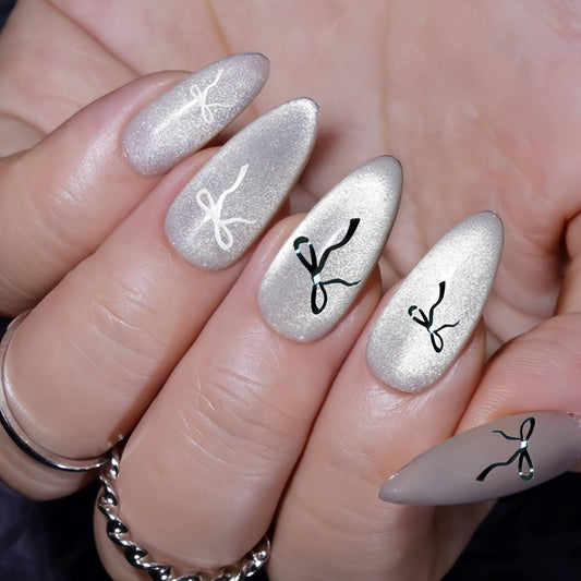 Glamorous Elegance Long Almond Glittery Silver Nail Set with Unique Ribbon Designs