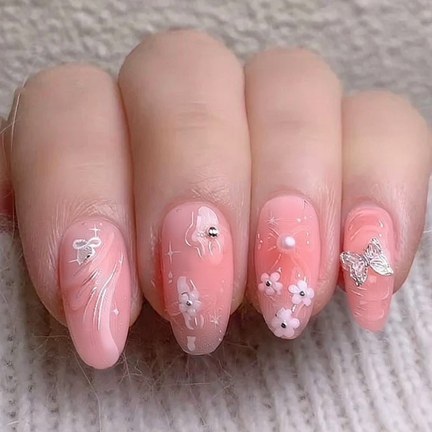 Whimsical Blossom Long Almond Pink Press on Nail Set with Floral Accents and Sparkling Details