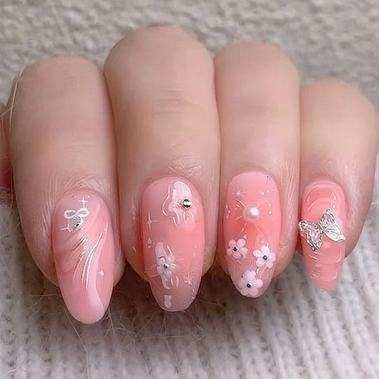 Whimsical Blossom Long Almond Pink Press on Nail Set with Floral Accents and Sparkling Details