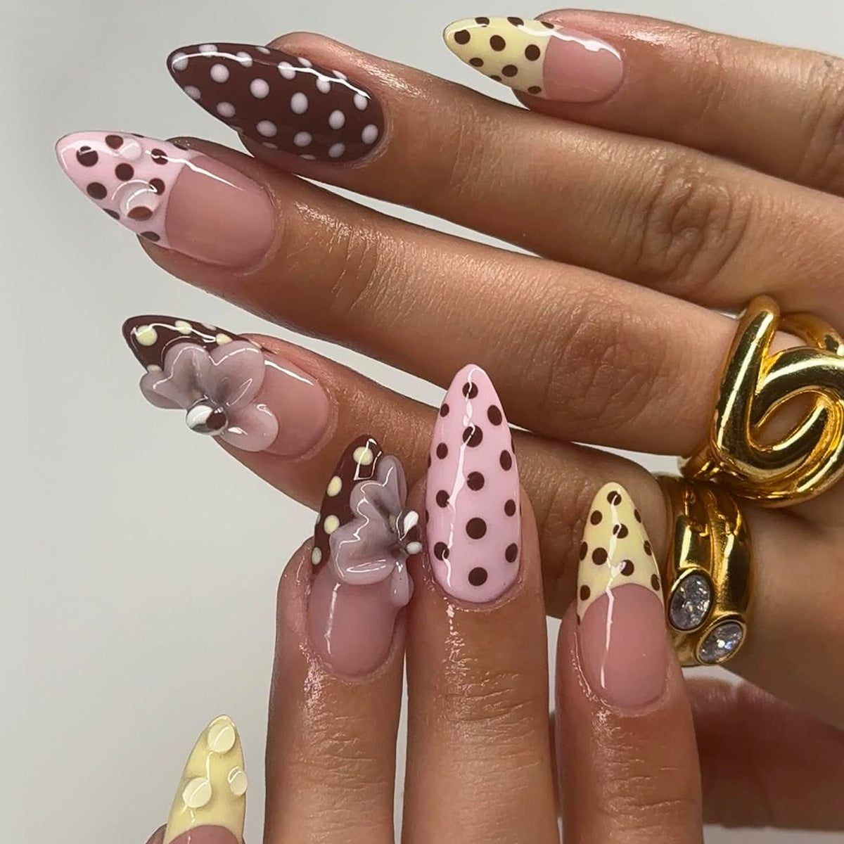 Charming Floral Design Medium Almond Pink and Brown Press-On Nail Set with Unique Polka Dot Accents