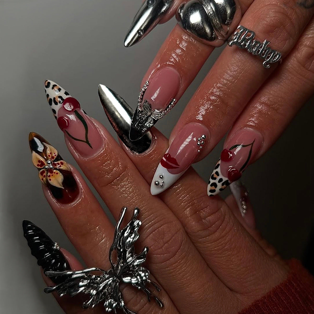 Glamorous Medium Almond Black and Brown Floral Press On Nail Set with Unique Metallic Accents