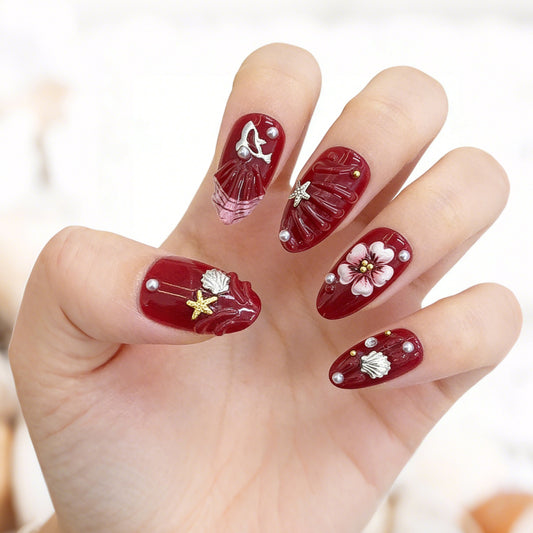 Oceanic Elegance Deep Red Medium Almond Shaped Nail Set with Intricate Floral and Shell Designs