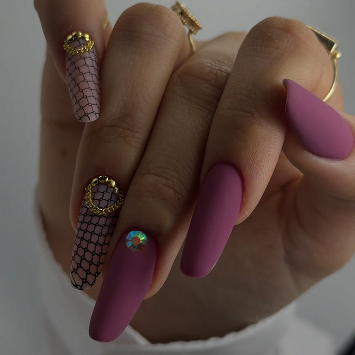 Glamorous Rose-Toned Medium Almond Press-On Nail Set with Elegant Chain and Gem Accents