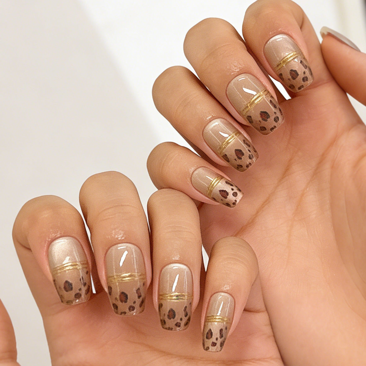 Wild Safari Inspired Short Square Glossy Beige Nails with Elegant Gold Accents and Trendy Leopard Print Design