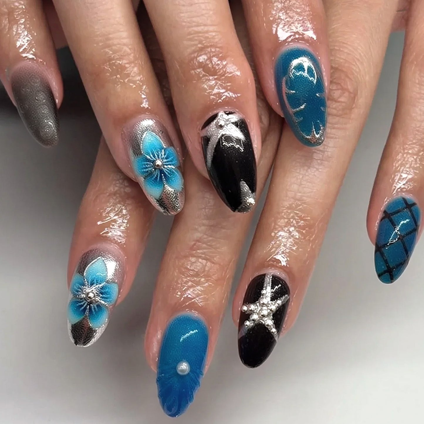 Ocean Breeze Long Almond Blue and Black Press-On Nail Set with Stunning Floral Designs