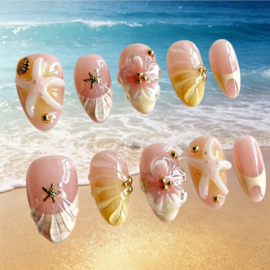 Coastal Serenity Long Almond Pink Nails with Shell Accents and Shimmering Gold Details
