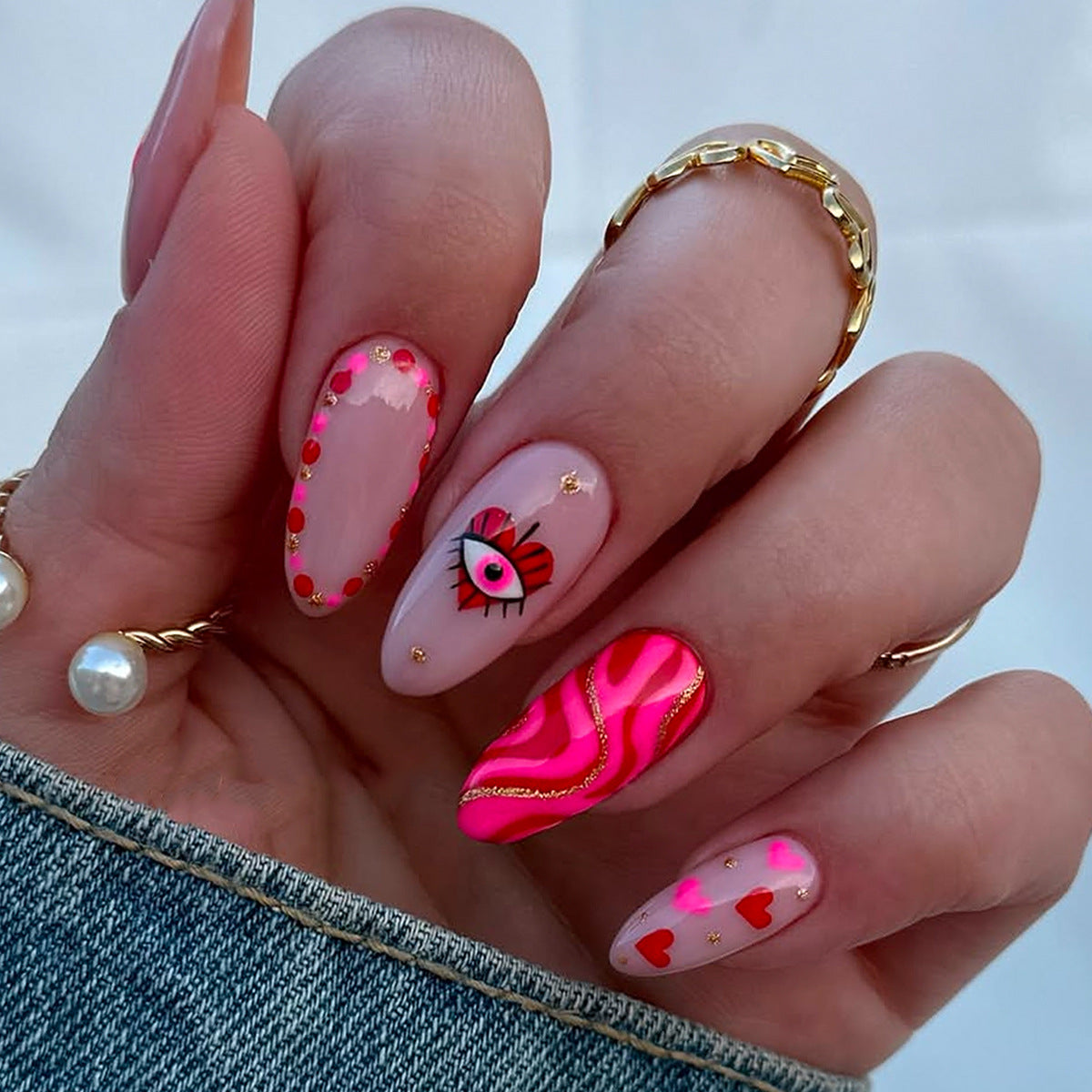 Whimsical Love Medium Stiletto Pink Press On Nail Set with Eye and Heart Design