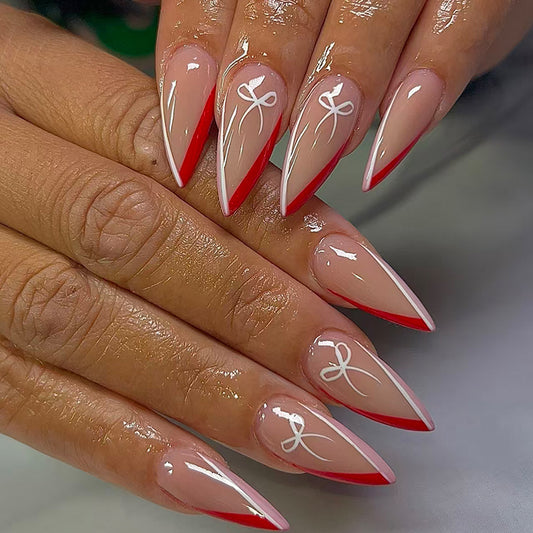 Enchanting Charm Long Stiletto Red Tip Press On Nail Set with Elegant White Design