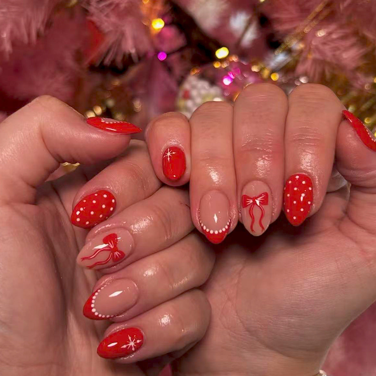 Festive Red Medium Almond Nail Set with Whimsical Bow and Polka Dot Design