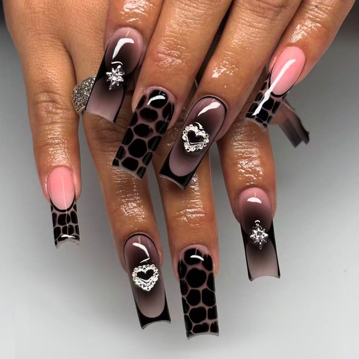 Glamorous Jungle Inspired Long Square Black Ombre Nails with Heart and Gem Accents
