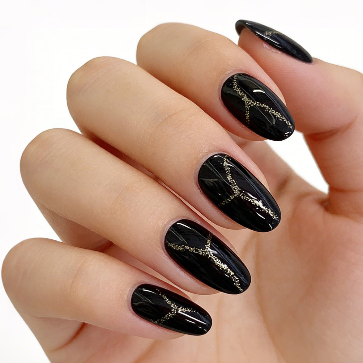 Elegant Nights Medium Almond Black Press-On Nail Set with Glittering Gold Design